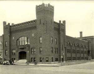 Old sepia tone photograph of the castle armory which is no home to multiple historic-venues in Rochester MN